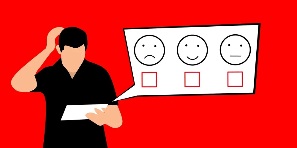 A man grins as he holds a paper featuring a smiley face, illustrating enthusiasm for Website Design and Development