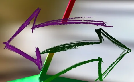 A laptop displaying a colorful arrow pointing to the screen, highlighting Website Design and Development concepts